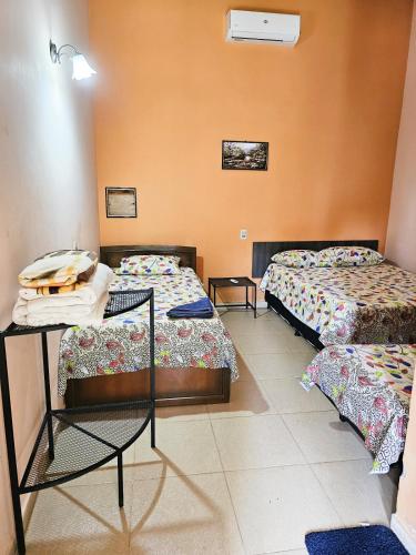 Postel nebo postele na pokoji v ubytování Hospedaje 63