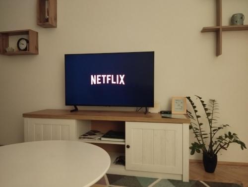 TV a/nebo společenská místnost v ubytování Corso Residence