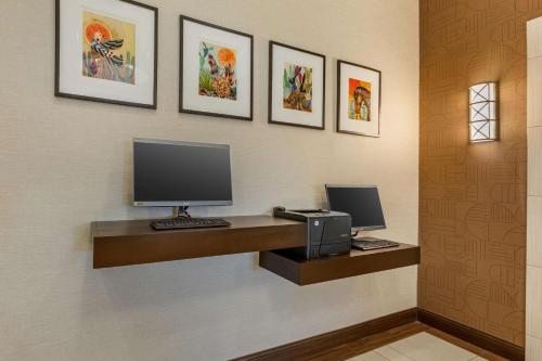 a office with a desk with a computer and a printer at Drury Plaza Hotel Phoenix Tempe in Tempe