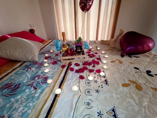 a bed with a table with flowers on it at Aloha chirripo cabaña familiar in Convento