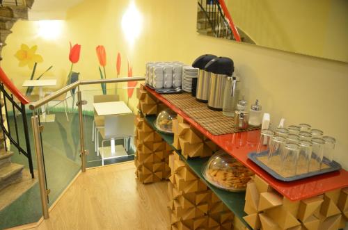 a kitchen with plates of food on a counter at Orestias Kastorias in Thessaloniki