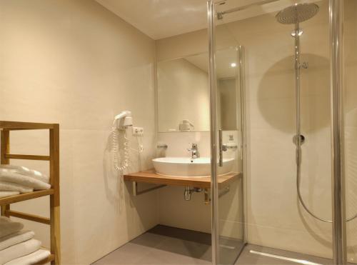 Kúpeľňa v ubytovaní Wohlfühlhotel Goiserer Mühle