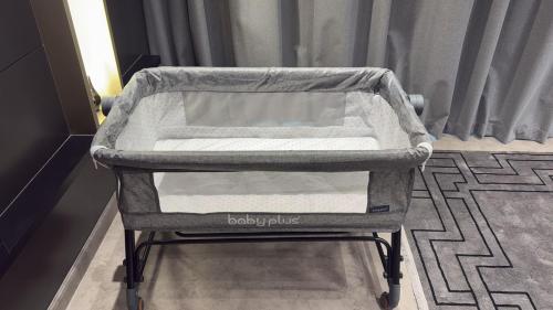 a baby carriage on a cart in a room at Luxury 2BR Close to Sheikh Zayed Rd, Prime Location, Burj View Opposite Metro in Dubai