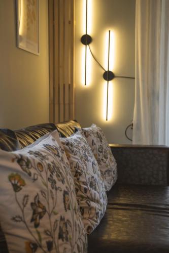 a living room with two pillows on a couch at Garden's House Pozar in Aridaia in Aridaia