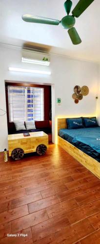 a bedroom with a bed and a wagon in it at Nhà riêng 3 phòng ngủ 6 giường in Hanoi