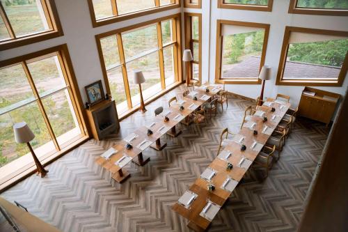 an overhead view of a large room with tables and windows at Wyndham Residences Aqkol in Akkol'