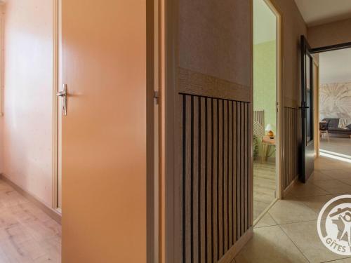 a hallway with a sliding door in a house at Gîte confortable au cœur du vignoble avec Wifi et parking, proche du Puy du Fou - FR-1-622-94 in Rablay-sur-Layon