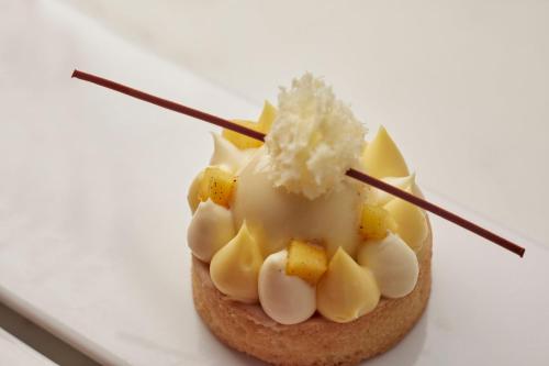 a piece of food on a white plate at Mandarin Oriental, Santiago in Santiago
