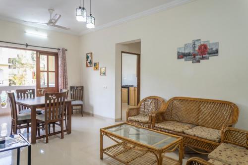 a living room with a table and chairs at 2BHK Private Apartment in Goa