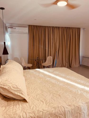 Postel nebo postele na pokoji v ubytování Bellamontagna Suites