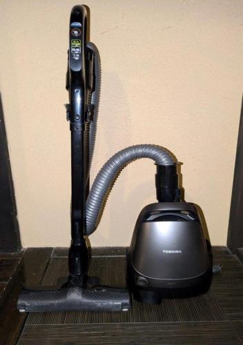 a black corded phone sitting on top of a floor at Kinzan Villa in Izu