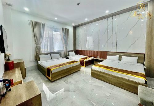 Postel nebo postele na pokoji v ubytování Khách Sạn Thiên Mỹ