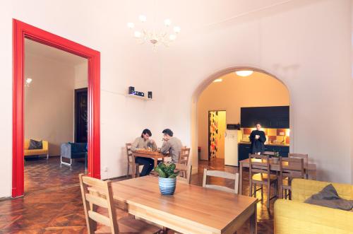 a living room filled with furniture and a table at Pal's Hostel and Apartments in Budapest