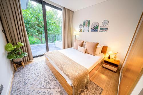 Postel nebo postele na pokoji v ubytování "BRG GOLF CLUB" - Danang Private Pool Villa 3 Bedrooms #1