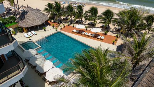 an overhead view of a swimming pool and the beach at Mana Mui Ne Beach Resort & Spa in Mui Ne