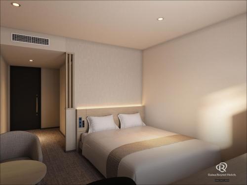 Postel nebo postele na pokoji v ubytování Daiwa Roynet Hotel Mito