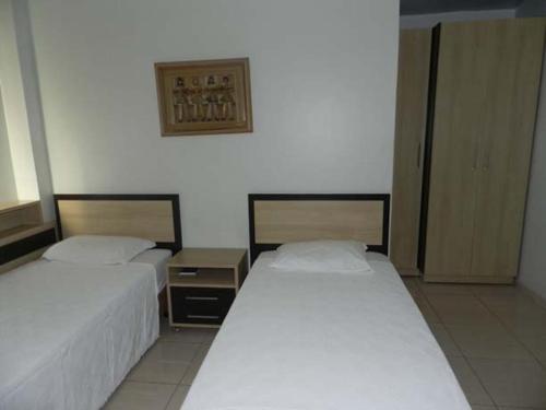 Ένα ή περισσότερα κρεβάτια σε δωμάτιο στο Hotel Estrela Palmas