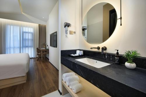 Ένα ή περισσότερα κρεβάτια σε δωμάτιο στο Riverbank Hotel