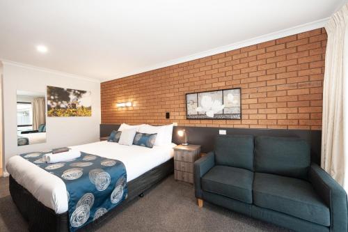 Postel nebo postele na pokoji v ubytování Motel Woongarra