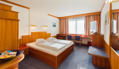 Ένα ή περισσότερα κρεβάτια σε δωμάτιο στο Vienna Sporthotel