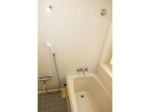 Ένα μπάνιο στο Beach Front Litore Iritahama - Vacation STAY 33142v