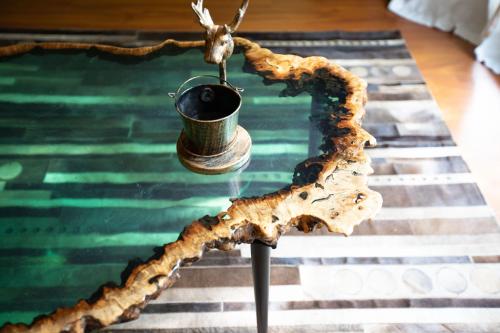a table with a drink in a cup on top of a table at Sanya Yalong Bay Danqiu Castle Manor Hotel in Sanya