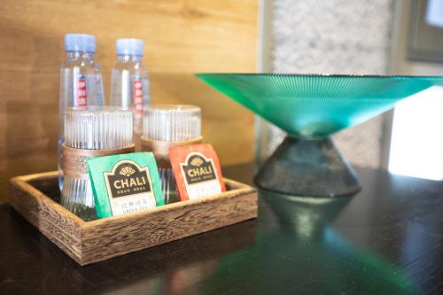 a table with a tray of spices and a martini glass at Sanya Yalong Bay Danqiu Castle Manor Hotel in Sanya