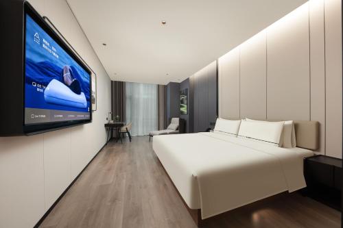 Voodi või voodid majutusasutuse Atour Hotel Fuzhou Mawei Free Trade Zone Oriental City toas