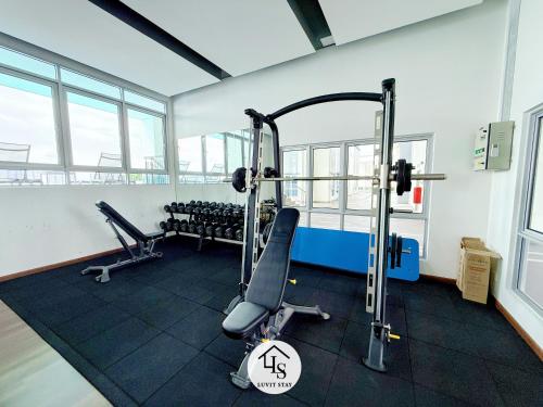 a gym with two tread machines in a room at Nexus Kajang MRT link - 3 BR Cozy Muji Suite # 28 in Kajang