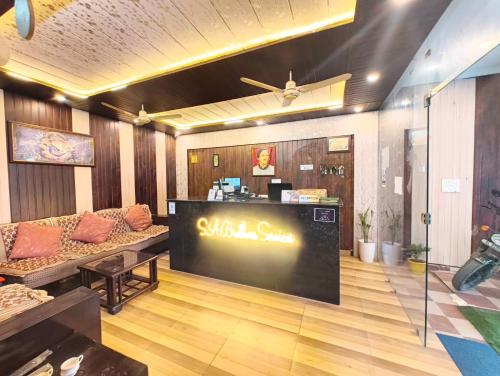 a lobby with a large sign in the middle of a store at Hotel Vishla Palace IN "Unit of SA Brothers Services" in Rishīkesh