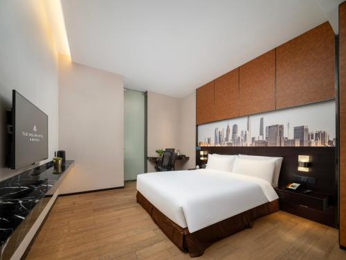 Postel nebo postele na pokoji v ubytování The Mulian Hotel Guangzhou Zhujiang New Town-Canton Fair Free Shuttle Bus