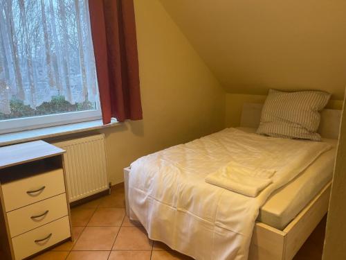 Postel nebo postele na pokoji v ubytování HS Hotel