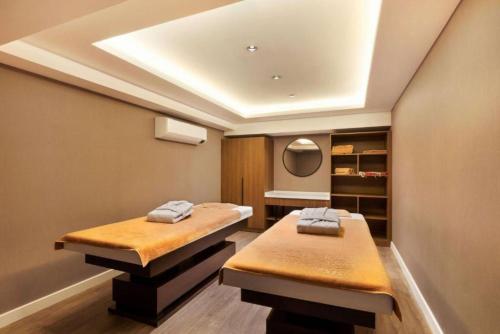 a room with two beds and a ceiling at Days Inn & Suites by Wyndham Esenyurt in Istanbul