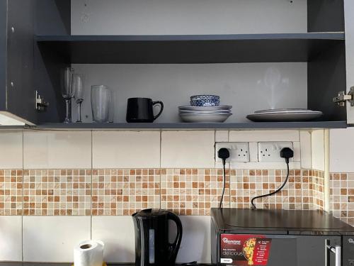Η κουζίνα ή μικρή κουζίνα στο Snowhaven bnb Kitengela