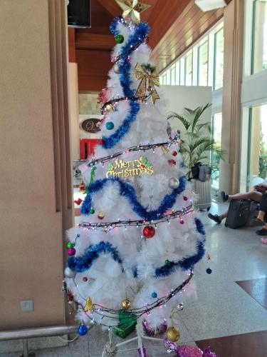 a christmas tree is decorated in a lobby at RKO Villa27 - Unawatuna in Habaraduwa