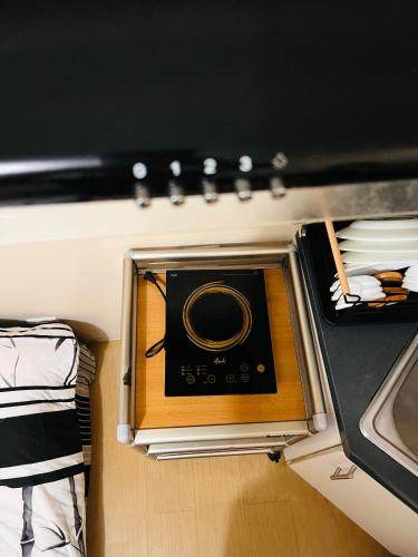 a room with a radio in the middle of a room at Avida Towers Atria in Iloilo City