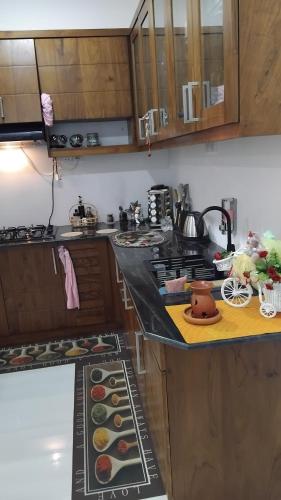 a kitchen with a stove and a counter with food on it at Serene Haven Villa in Batapola