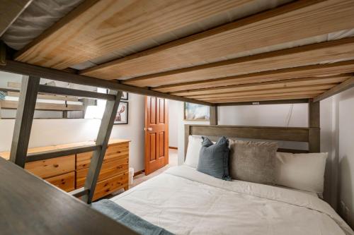 a bedroom with a bed and a wooden ceiling at Sunpath by Outpost Whistler in Whistler
