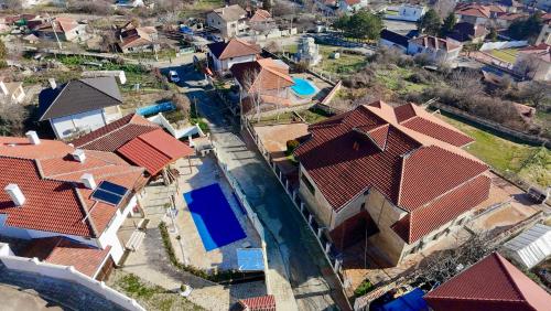 an overhead view of a house with red roofs at Villa Makeli in Rogachevo
