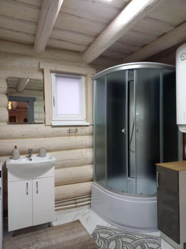 a bathroom with a shower and a sink at Шепіт лісу in Lazeshchyna