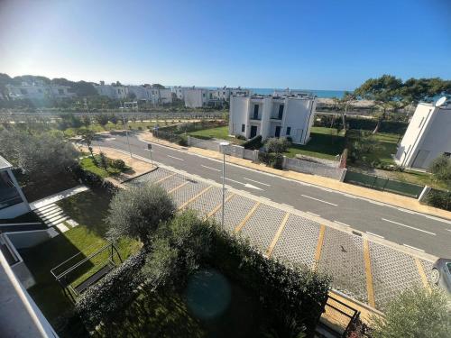 an empty street with a fence and a road at Valamar Sea View Apartment in Hamallë