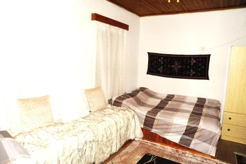 Postel nebo postele na pokoji v ubytování Isidora House