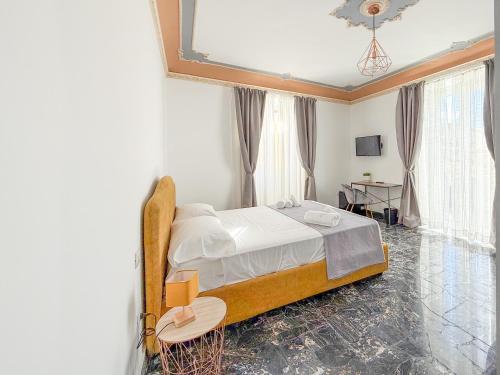 Postel nebo postele na pokoji v ubytování FeVi Rooms