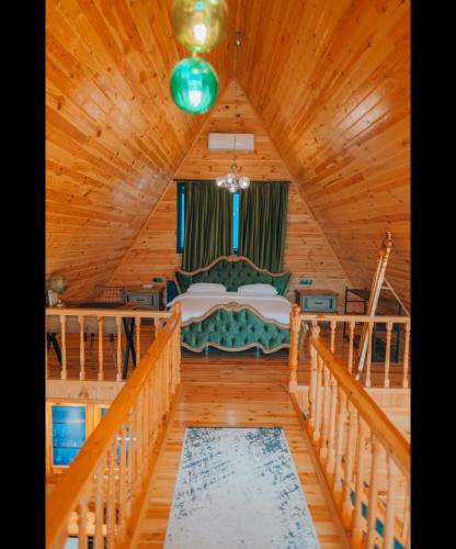 a bedroom with a bed in a wooden house at 7Sense Nature Resort in Sapanca