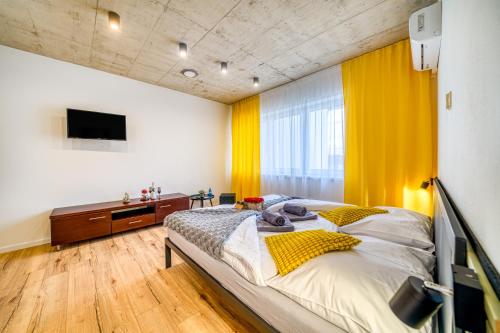 Postel nebo postele na pokoji v ubytování HM Apartments
