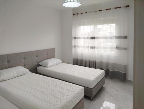 Gulta vai gultas numurā naktsmītnē Spacious Comfortable apartment