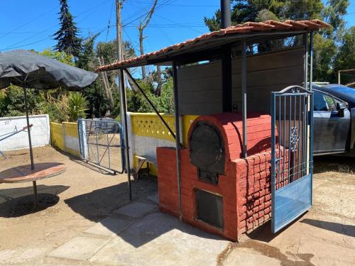 a small playground with a building on top of it at Cabaña Las Cruces, a pasos de la playa in Las Cruces
