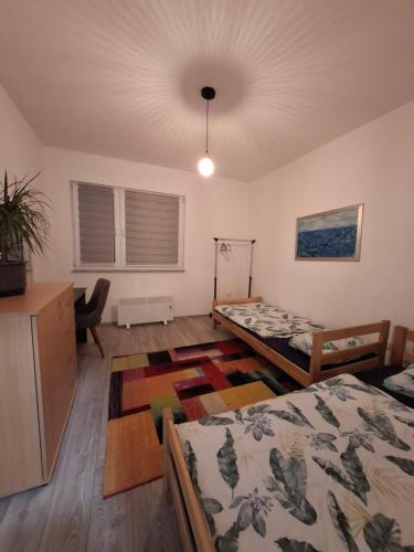 Postel nebo postele na pokoji v ubytování Apple Home
