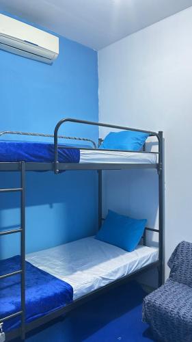 Ένα ή περισσότερα κρεβάτια σε δωμάτιο στο A Room in Santorini House Room Near Airport Bali