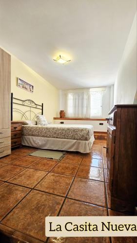 a bedroom with a large bed in a room at La Casita Nueva in El Socorro